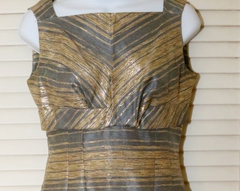 May include: A sleeveless dress with a gold and gray striped pattern. The dress has a square neckline and a fitted bodice.