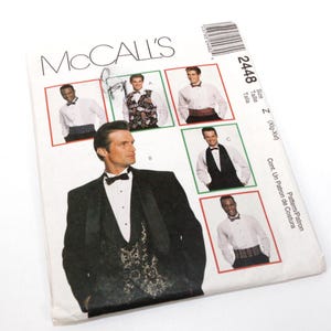 Op de afbeelding: Een McCall's naaipatroonpakket met afbeeldingen van mannen in formele kleding, waaronder smokings en vesten. Het pakket is wit met het McCall's logo en patroonnummer 2448.