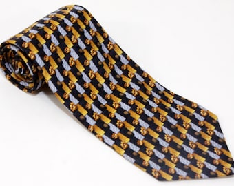 May include: A black silk tie with a repeating pattern of gold and silver geometric shapes.