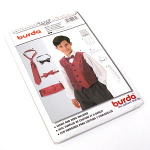 May include: A Burda pattern packet featuring a young person in a burgundy vest, white shirt, and dark pants. The packet includes illustrations of accessories like a tie, bow tie, and cummerbund. The text on the packet reads "WESTE - ACCESSORIES" and "SEAMS AND HEMS INCLUDED."