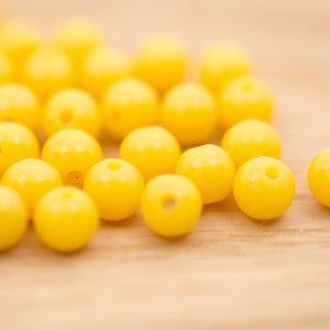 35 count 8mm vintage lucite bright sunny yellow colored marbled opaque round ball bead shaped plastic beads bead destash lot