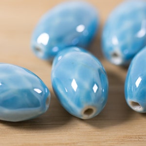 5 count 27mm high quality cyan sky blue glossy porcelain ceramic beads oval shaped faceted glazed ceramic beads bead clay round