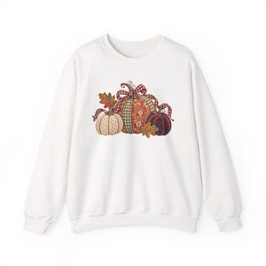Gezellige trui met pompoenen in ruitjes- en patchworkstijl | Herfstdecoratie