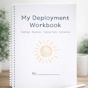May include: A white spiral-bound workbook with the title "My Deployment Workbook" in blue text. The cover includes the words "Feelings, Routines, Coping Tools, Connection" and a sun illustration. The words "By:" are at the bottom.