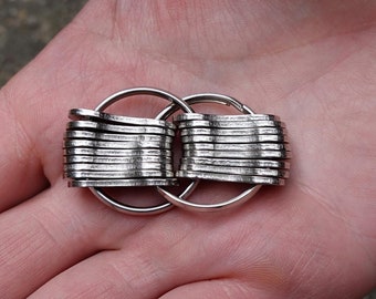 Anti-stress fidget (puzzle) made from plates from a recycled bike chain