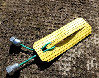 Medium-level puzzle – made from fire hose, paracord, and bike wheel nuts