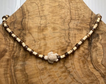 Tan\brown choker with turtle