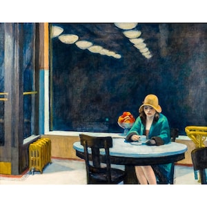 May include: A woman in a green coat and a yellow hat sits at a table in a dimly lit room. She is holding a cup of coffee and looking out the window. There is a bowl of fruit on the table and a radiator in the background.