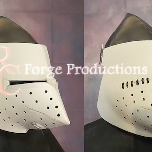 May include: A white helmet with a visor and a face mask with holes. The helmet is made of metal and has a textured surface. The helmet is on a display stand.