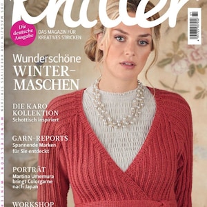 May include: The Knitter magazine cover features a woman wearing a red knitted cardigan with a white shirt underneath. The magazine title is "The Knitter" and the subtitle is "Das Magazin für Kreatives Stricken". The cover also features the text "Wunderschöne Winter-Maschen" and "Die Karo Kollektion Schottisch inspiriert".