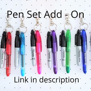 May include: A set of ten Sharpie mini pens with keychains. The pens are in various colors, including black, red, blue, turquoise, pink, purple, green, and orange.