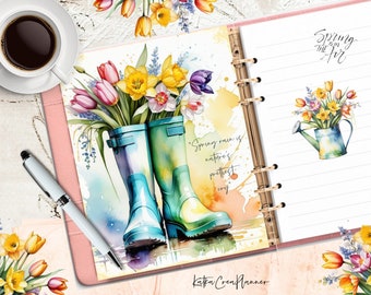 May include: A watercolor illustration of a pink and green planner with a floral design. The planner has a quote that says "Spring rain is nature's prettiest cry". The planner also has a floral design with a watering can and the words "Spring is in the air".