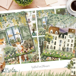 Puede incluir: Un conjunto de 9 pegatinas para planificador con ilustraciones de acuarela de edificios, flores y un gato. Las pegatinas están sobre un fondo blanco con hierba verde en la parte inferior. El texto "Katka Crea Planner" está en la parte inferior de la imagen.