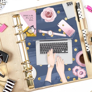May include: A gold binder with a blue and gold patterned cover. The cover features a laptop, a phone, a watch, a cup of coffee, and donuts. The text "DREAM. PLAN. DO." is on a pink background in the upper left corner.