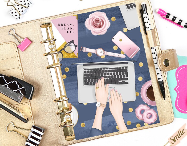 May include: A gold binder with a blue and gold patterned cover. The cover features a laptop, a phone, a watch, a cup of coffee, and donuts. The text "DREAM. PLAN. DO." is on a pink background in the upper left corner.