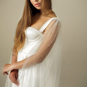 Lightweight ivory wedding wings cape with soft draping tulle fabric