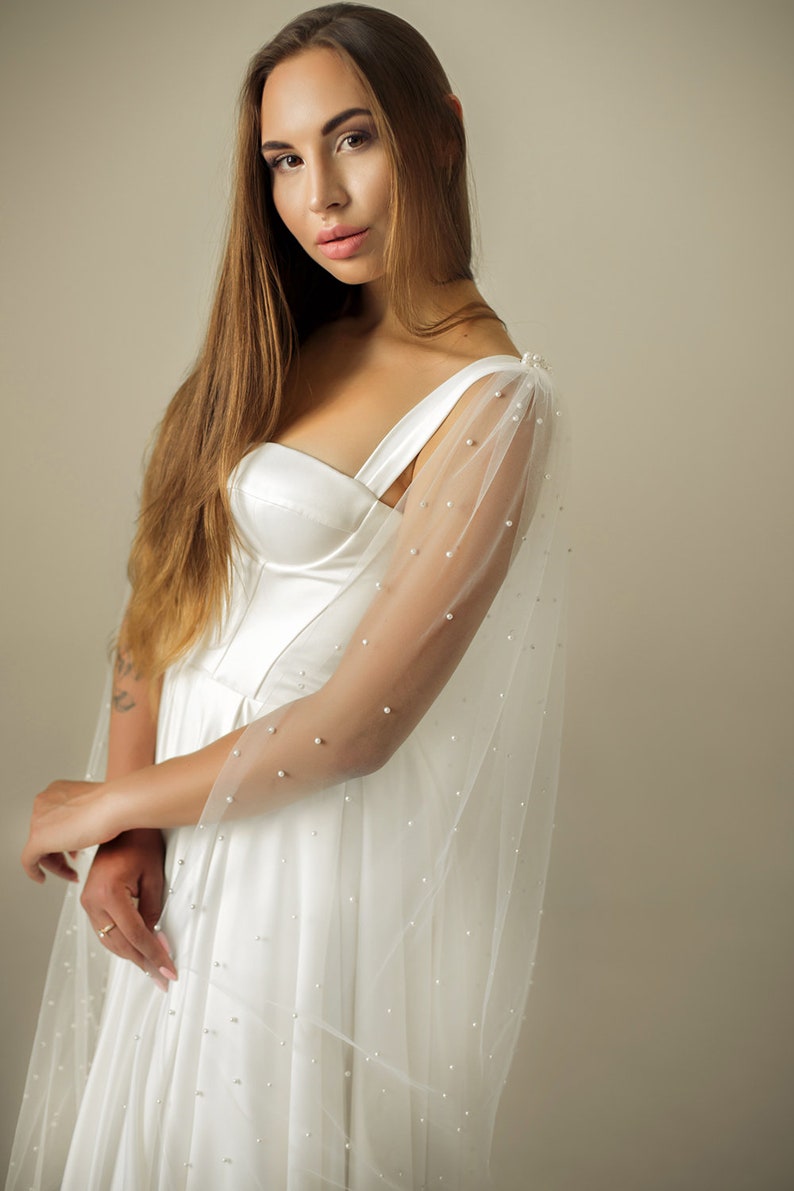 Lightweight ivory wedding wings cape with soft draping tulle fabric