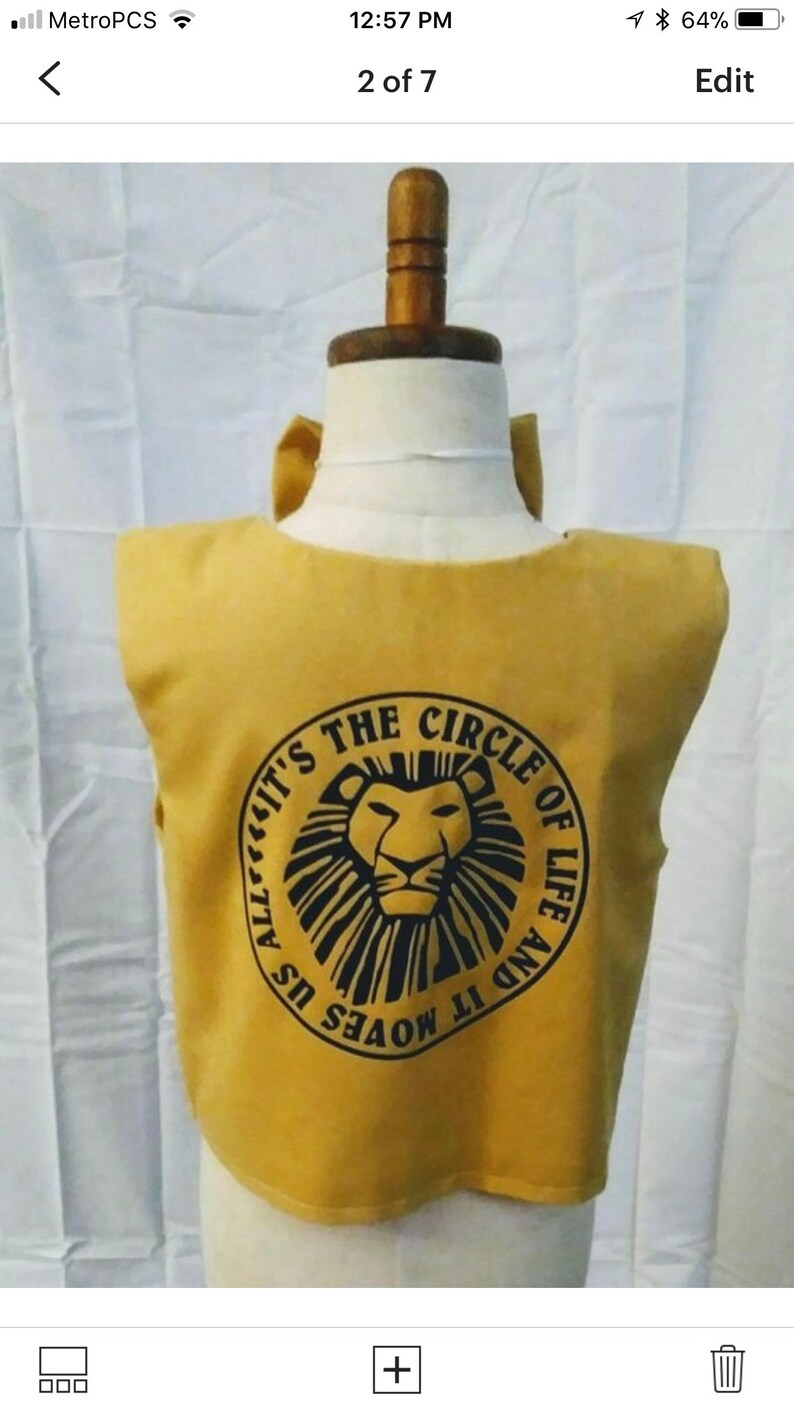 May include: A yellow sleeveless shirt with a black circle design featuring a lion's face and the text "It's the Circle of Life and It Moves Us All".