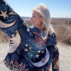 Suéter tipo manta extragrande con diseño de bailarina celestial