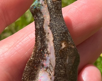 Polished Australian boulder opal specimen