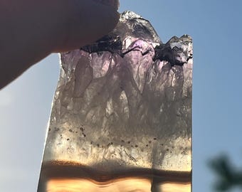 Brazilian polished amethyst slice with banded agate