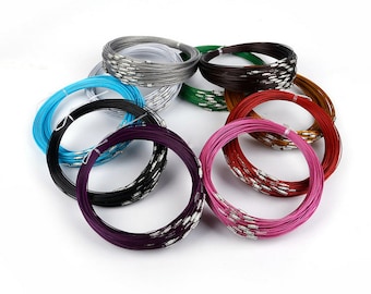 May include: Assortment of colorful metal wire spools, each spool is a different color, including silver, brown, green, red, gold, black, purple, and pink.