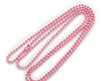 May include: A pink metal chain necklace with a lobster clasp. The chain is made of small, round beads.