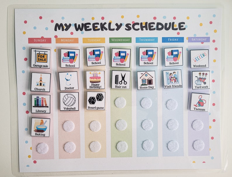 May include: A colorful weekly schedule chart with a grid of squares and circles. Each square has a different activity, such as "Garage Sale", "School", "Church", "Doctor", "Happy Birthday", "Hair Cut", "Home Day", "Visit Friends", "Yard Work", "Library", "Volleyball", "Board Game", "Baking", and "Vacuum".