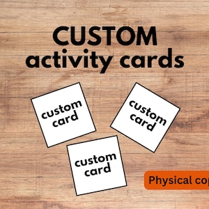 May include: Three square white activity cards with the black text custom card printed on each. The words CUSTOM activity cards appear in large black letters at the top, and an orange rectangular label reads Physical copy at the bottom.