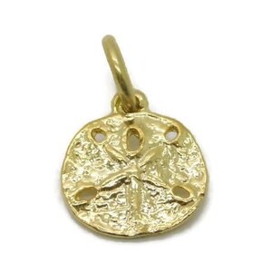 Tiny sand dollar charm pendant 14k yellow gold.