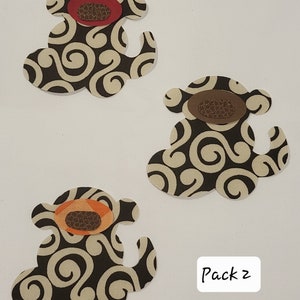 May include: A pack of three fabric monkey appliques with a swirl pattern. The monkeys have different coloured faces: red, brown, and orange. The text "Pack 2" is visible in the image.