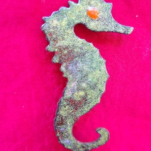 Vintage brass seahorse brooch with enamel finish