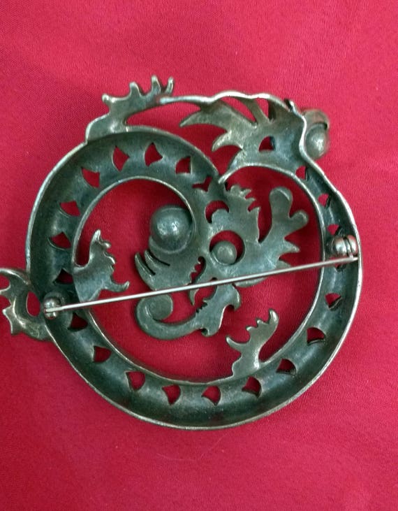 stylized coiled brass dragon brooch with plastic … - image 2