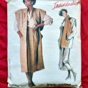 May include: Vintage sewing pattern titled "Individualist" by Jenny Sharp. The pattern features a woman in a long vest and skirt ensemble. The pattern's color scheme is beige, white, and red. The pattern number is 1412.