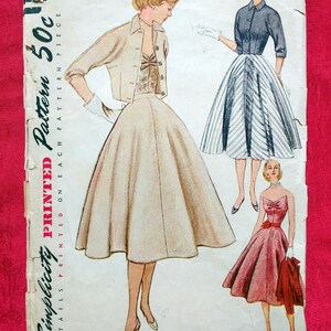 Rare 1950s cocktail flared skirt, wing front strapless bodice, and trim fitted jacket.  Simplicity 8471.  Size 12 B 30