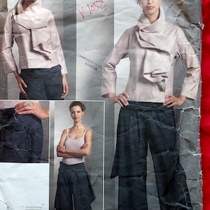 May include: A Vogue Designer Original pattern by Issey Miyake, V1052, featuring a light-colored jacket with a unique collar and wide-leg pants. The pattern includes sizes AA (6-8-10-12).