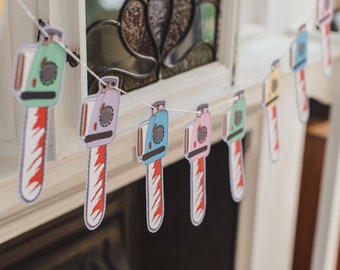 Chainsaw Garland, pastel goth, pastel halloween, halloween bunting, bloody chainsaw, horror decor