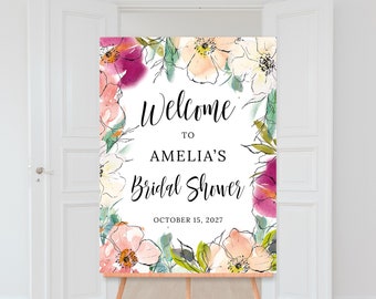 Könnte beinhalten: Ein Willkommensschild für eine Brautparty mit Aquarellblumen in Rosa, Pfirsich und Lila. Auf dem Schild steht "Welcome to Amelia's Bridal Shower" und das Datum "October 15, 2027". Das Schild wird auf einer Holzstaffelei präsentiert.