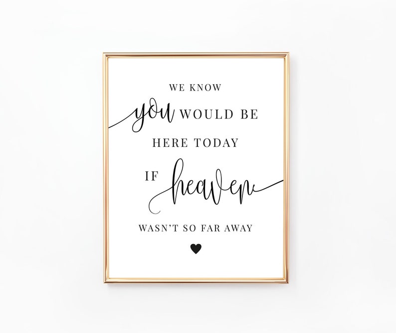 May include: A white sign with a gold frame and black text that reads "We know you would be here today if heaven wasn't so far away". A small black heart is at the bottom of the sign.