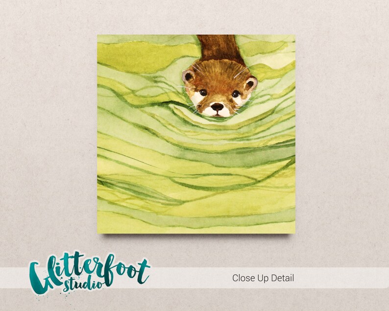 May include: Watercolor illustration of an otter emerging from green and yellow water. The otter has brown fur and a white face. The image has the text "Glitterfoot Studio" and "Close Up Detail".