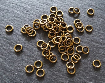 200 o 1000 anillos de salto de 5 mm de diámetro en tono bronce antiguo, fuertes, 0,9 mm (calibre 20)