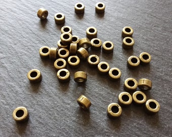 20 ou 100 perles intercalaires unies 6 mm couleur bronze antique 6 x 3 mm. Trou de 2,8 mm