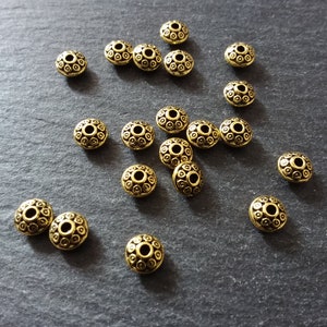 20 or 100 Antique Gold Tone 6.5mm Flying Saucer Shaped Spacer Beads. Hole: 1mm