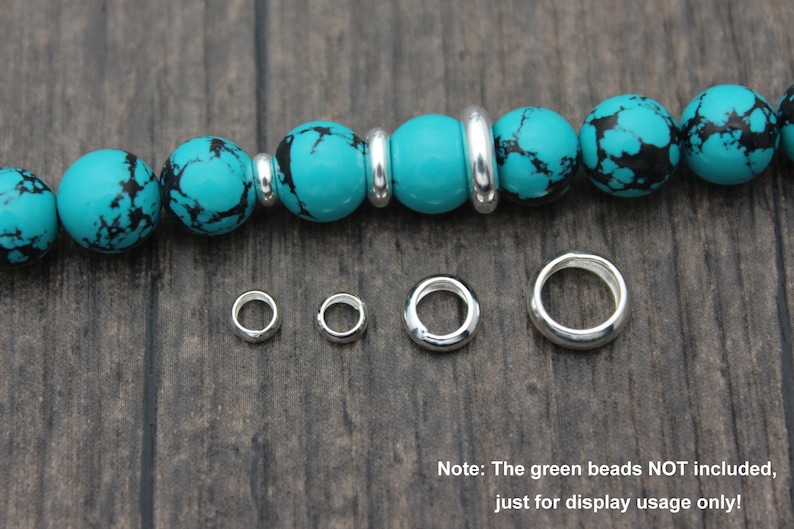 May include: Silver jump rings in various sizes, perfect for jewelry making. The rings are shown next to a turquoise beaded bracelet, but the beads are not included.