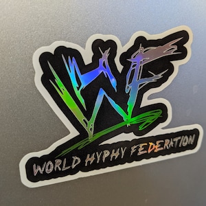 May include: A black and white sticker with a holographic "WF" logo and the text "WORLD HYPHY FEDERATION".