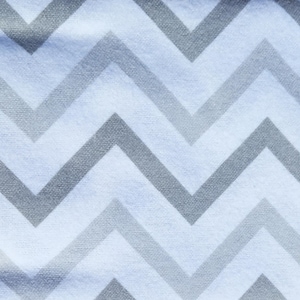 May include: White fabric with a chevron pattern in grey. The fabric has a soft, textured feel.