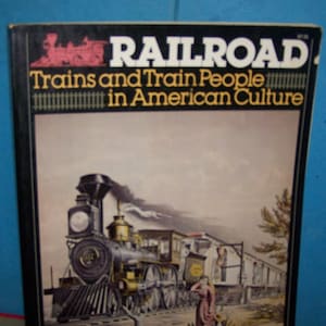 May include: A vintage book cover with a black background and the title "RAILROAD Trains and Train People in American Culture". The cover features a colorful illustration of a steam locomotive pulling a train with people standing on the platform.