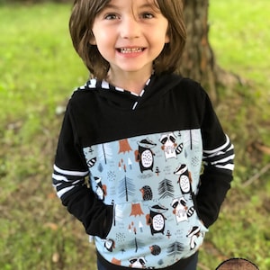 Versatile model for children. Hoodie with front pocket. Forest animal design.