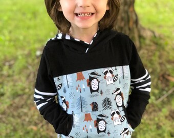 Versatile model for children. Hoodie with front pocket. Forest animal design.