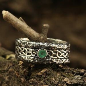 Hammered antique style sterling silver celtic wedding band with emerald for women or men